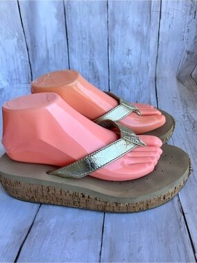 Volatile Gold thong wedge sandals with a cork platform,